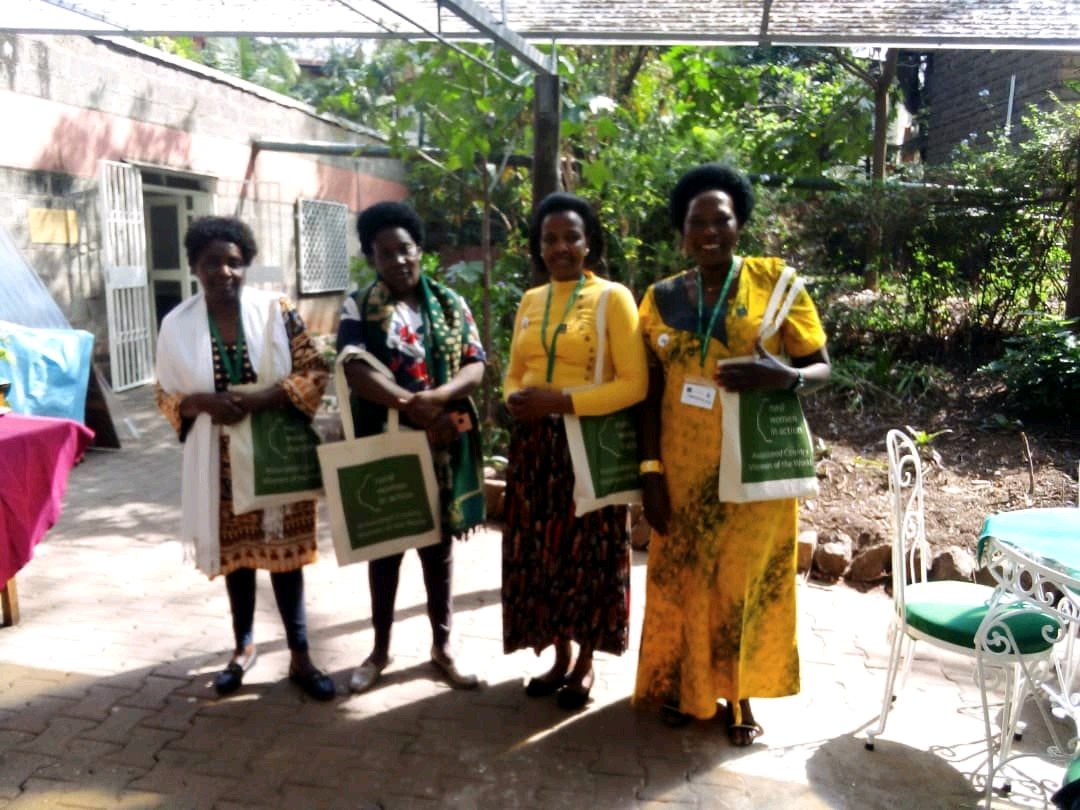 Four women at a Women Grow Uganda training event